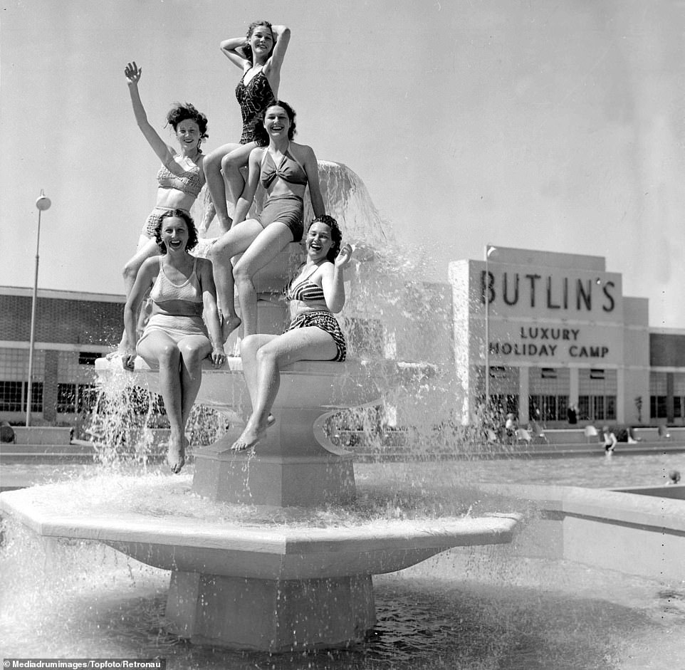A pyramid of bikini-clad tourists posing in a water fountain in Clacton, Essex as they take their holiday during the early warm spell at Butlin's holiday camp. Butlin opened the second resort in Clacton-on-Sea before the end of the 40s