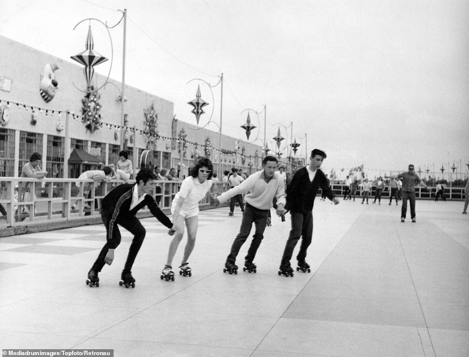Four people go roller-skating in Skegness, a seaside town in Lincolnshire. Despite opening the first camp in 1936, it is the 50s and 60s that most people think of as the heyday of Butlin's and the British holiday camp