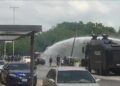 Police use water cannons against protesters in Nigeria